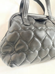 Vintage MOSCHINO black heart shape quilted lambskin mini handbag, tote purse. Too cute to carry.