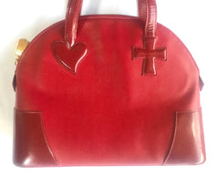 Vintage Christian Lacroix red patent enamel and leather bolide bag with golden logo zipper charm. Comes with shoulder strap. 0403172