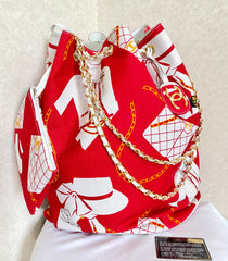 Vintage CHANEL red and white canvas large hobo shoulder bag with supermodel print and CC charm. Mademoiselle. 0407231