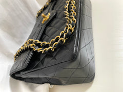 80's vintage Chanel black 2.55 shoulder bag with circle CC  flap design. Rare piece from the era. 0410283