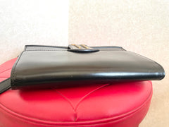 Vintage Lanvin black leather shoulder bag with iconic golden logo motif, Classic purse for daily use. 050222ya1