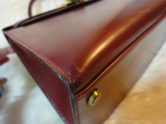 1980s Vintage HERMES Kelly 32 bag rouge ash box calf leather with gold hardware. Exterior stitch. Stamp K in O, 1981. Best known classic bag