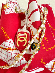 Vintage CHANEL red and white canvas large hobo shoulder bag with supermodel print and CC charm. Mademoiselle. 0407231