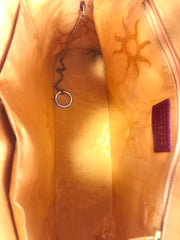 Vintage Christian Lacroix red patent enamel and leather bolide bag with golden logo zipper charm. Comes with shoulder strap. 0403172