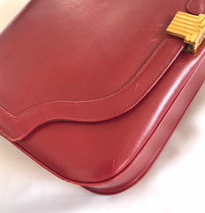 Vintage Lanvin wine leather shoulder bag with golden logo motif closure. Classic must have purse. 060620r2