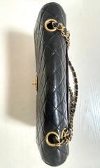 80's vintage Chanel black 2.55 shoulder bag with circle CC  flap design. Rare piece from the era. 0410283