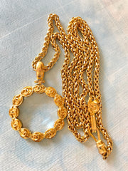 Vintage CHANEL long chain necklace with round glass loupe pendant top and CC motifs. Can be worn in double. Gorgeous masterpiece.0411111