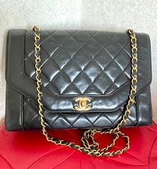Vintage Chanel black lambskin chain 2.55 shoulder bag with gold chain. Unique hexagon shaped flap. 0407012