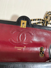 80's vintage Chanel black 2.55 shoulder bag with circle CC  flap design. Rare piece from the era. 0410283