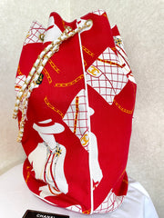 Vintage CHANEL red and white canvas large hobo shoulder bag with supermodel print and CC charm. Mademoiselle. 0407231