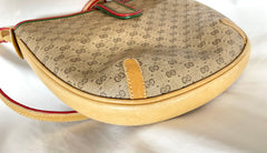 Vintage Gucci GG monogram shoulder bag with red and green webbing color convo shoulder bag. Golden and silver GG motif on the flap. 0411273