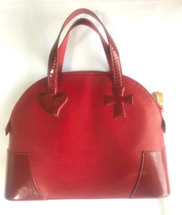 Vintage Christian Lacroix red patent enamel and leather bolide bag with golden logo zipper charm. Comes with shoulder strap. 0403172