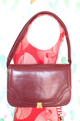 Vintage Lanvin wine leather shoulder bag with golden logo motif closure. Classic must have purse. 060620r2