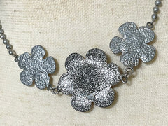 Vintage CHANEL silver matelasse camellia, rose flower charm necklace. Classic Chanel jewelry for your collection. So chic and mod. 0410031