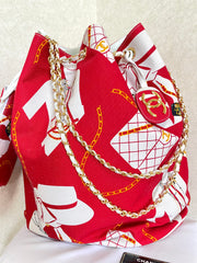 Vintage CHANEL red and white canvas large hobo shoulder bag with supermodel print and CC charm. Mademoiselle. 0407231