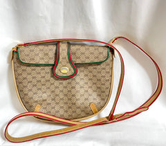 Vintage Gucci GG monogram shoulder bag with red and green webbing color convo shoulder bag. Golden and silver GG motif on the flap. 0411273