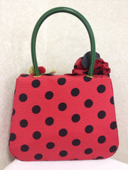 MINT. Vintage Moschino red and black canvas polkadot kelly handbag with a matching rose flower and leaf and crochet fruits motifs. 0506307