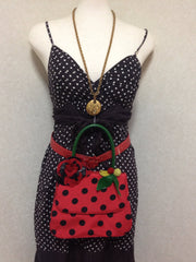 MINT. Vintage Moschino red and black canvas polkadot kelly handbag with a matching rose flower and leaf and crochet fruits motifs. 0506307