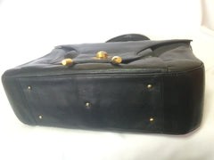 Vintage Bally black leather retro pop design bag, business purse with gold tone drawstrings and unique flap cut design.  Unisex use. 160315