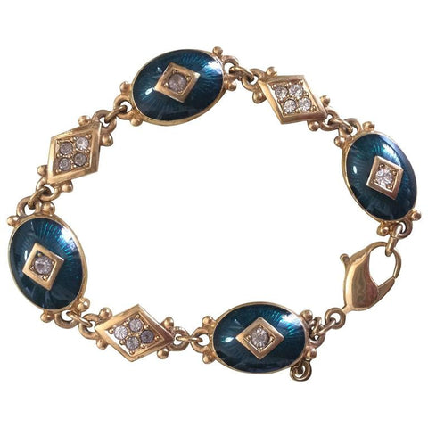 Vintage Burberrys golden gorgeous bracelet with oval emerald green and diamond shape charms with rhinestone crystals. Burberry jewelry.