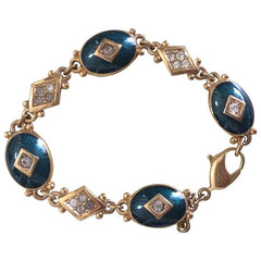 Vintage Burberrys golden gorgeous bracelet with oval emerald green and diamond shape charms with rhinestone crystals. Burberry jewelry.
