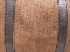 80's vintage Christian Dior Bagages genuine brown suede leather travel duffle bag, purse with embossed Dior logo allover. Unisex luggage