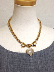 MINT. Vintage Nina Ricci golden chain statement necklace with ribbon bow and crystal stone heart pendant top. Perfect vintage jewelry