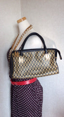 Vintage MOSCHINO black and ivory beige logo M print handbag, mini duffle bag with leather trimmings and golden M charms. 060521re1