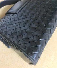 1990s. Vintage Bottega Veneta classic black lamb leather intrecciato handbag with golden closure hock. Gorgeous masterpiece from Bottega.