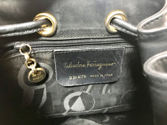 Vintage Salvatore Ferragamo black leather hobo style shoulder bag with vara logo motif and drawstrings. Classic bag for daily use. 050317r1
