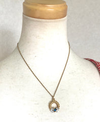 Vintage LANVIN golden skinny chain necklace with golden round pendant top. Clear crystals and green glass stone. Perfect jewelry gift.