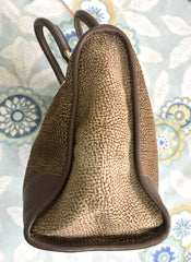 Vintage Borbonese by red wall, brown and beige leather classic bag with golden logo charm.  Unisex use. Masterpiece.