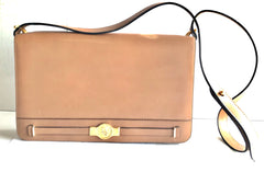 Vintage Christian Dior tanned brown leather shoulder clutch bag with golden CD motif.