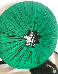 Vintage Nina Ricci black suede and green satin mix round shoulder bag with fringes and enamel star motif. Suzy Wong design. Collectible bag. 060616r3
