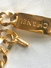 Vintage CHANEL golden thick chain belt with logo engraved bar motifs and a round charm to the end. Must have gorgeous accessory.