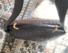 Vintage GUCCI dark brown genuine ostrich leather fisherman bag style shoulder bag with logo embossed motif. Rare masterpiece.
