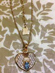 Vintage LANVIN golden skinny chain necklace with heart logo charm pendant top with clear crystals and blue crystal. 080323re1