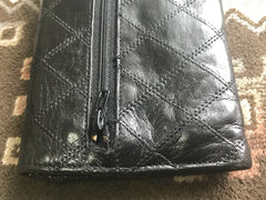 1980s. Vintage CHANEL black goatskin bill, card, checkbook long wallet pouch purse with  mini CC motif.  Classic unisex style.