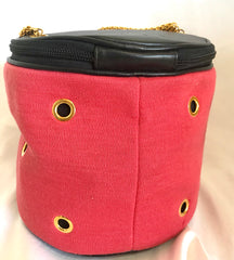 Vintage Moschino by Redwall lunchbox design red jersey and black leather handbag with golden eyelets and ball charms. 0506289