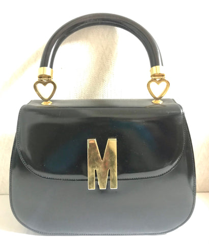 Vintage MOSCHINO black patent enamel Kelly style handbag with M logo and heart motifs. Masterpiece by Redwall. 050323re4