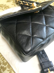 1980s. Vintage CHANEL black lamb leather belt bag, waist bag, fanny pack with golden chain belt & CC closure.  Belt size good for 23.8" through 26.2" (60.5-66.5cm)