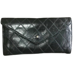 1980s. Vintage CHANEL black goatskin bill, card, checkbook long wallet pouch purse with  mini CC motif.  Classic unisex style.