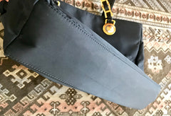 Vintage Gianni Versace large black nylon and leather combination tote bag with gold tone sunburst motifs and chains. 050425r4