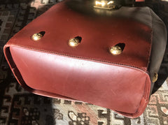 Vintage Salvatore Ferragamo brown leather purse with gold tone elegant closure. Featuring Ferragamo charms. 060516re4