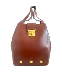 Vintage Salvatore Ferragamo brown leather purse with gold tone elegant closure. Featuring Ferragamo charms. 060516re4