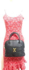 Vintage Paloma Picasso black leather bolide bag style handbag with iconic golden logo motif. Classic shape bag.
