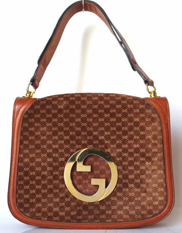 Vintage Gucci brown leather micro GG print shoulder bag with iconic golden large round GG motif. Rare masterpiece purse.