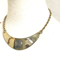 Vintage Celine gold tone crescent moon shape necklace with silver triomphe logo. 05062810
