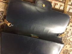 Vintage Nina Ricci navy leather clutch chain shoulder bag, classic purse with golden ribbon logo motif. Mod and chic daily purse.