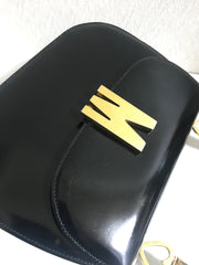 Vintage MOSCHINO black patent enamel Kelly style handbag with M logo and heart motifs. Masterpiece by Redwall. 050323re4